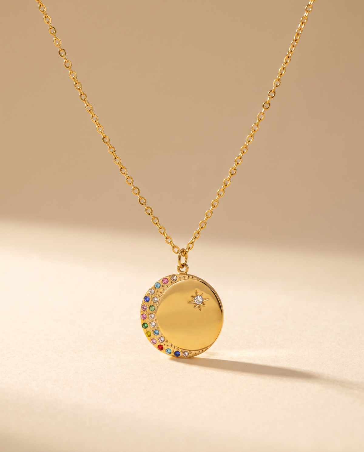 Oval Diamond Drop Necklace — stainless steel with 18K gold plating, on a plain ground, view 3.
