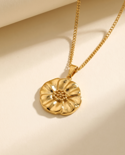 Poppy Flower Pendant Necklace in gold — a pendant on a chain in stainless steel with 18K gold plating.