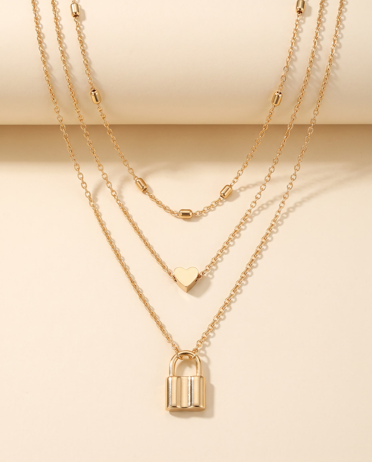 Layered Love Lock Necklace in gold, made in gold-plated copper.