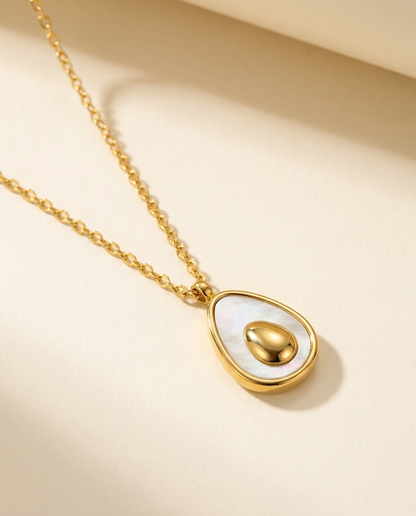 Avocado Pendant Necklace, on a plain ground.