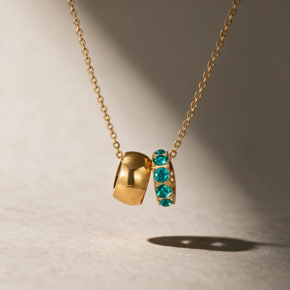The Linked Birthstone Necklace in blue.