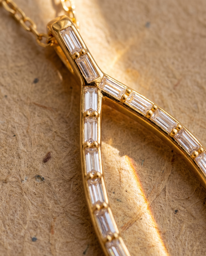 Close view of the wishbone pendant