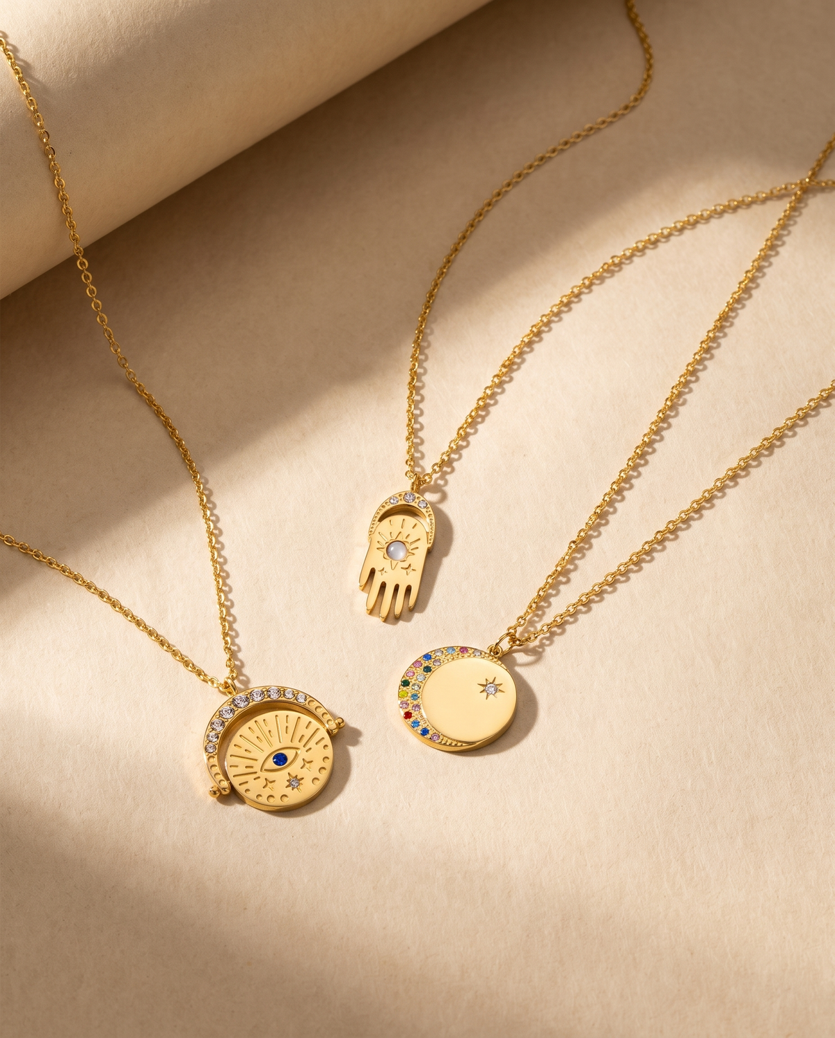 Oval Diamond Drop Necklace — stainless steel with 18K gold plating, on a plain ground, view 4.