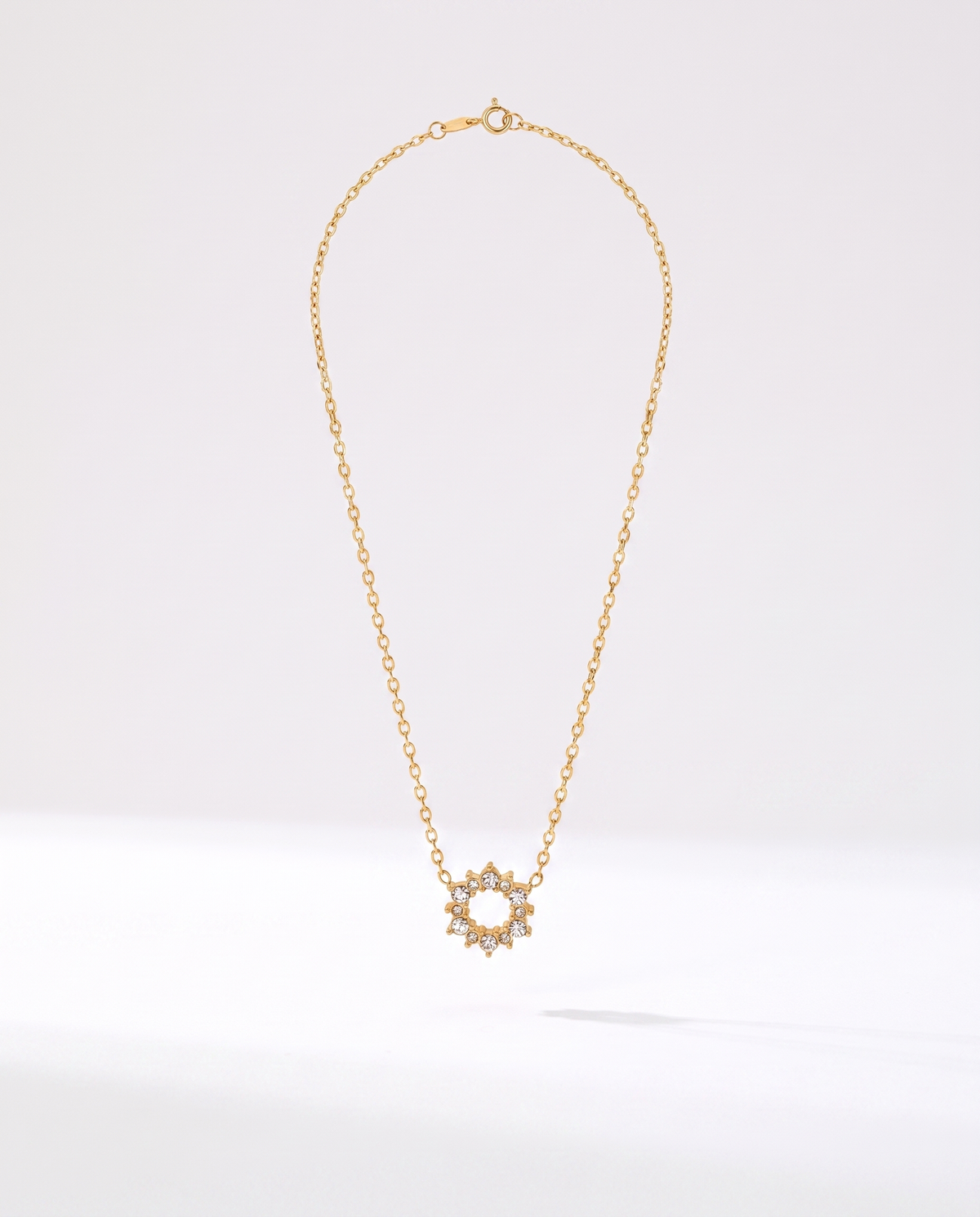 Geometric Ring Pendant Necklace in gold — a pendant on a chain in stainless steel with 18K gold plating.