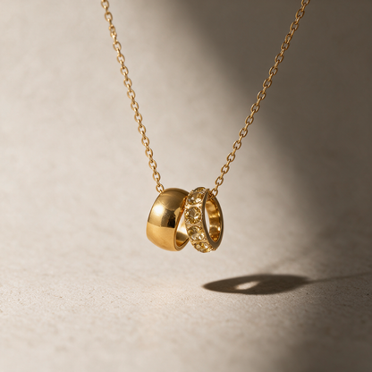 The Linked Birthstone Necklace in yellow, styled in natural light.
