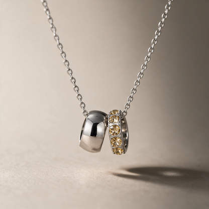 The Linked Birthstone Necklace in yellow, styled in natural light, view 10.