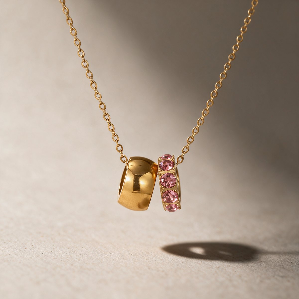 The Linked Birthstone Necklace in pink.