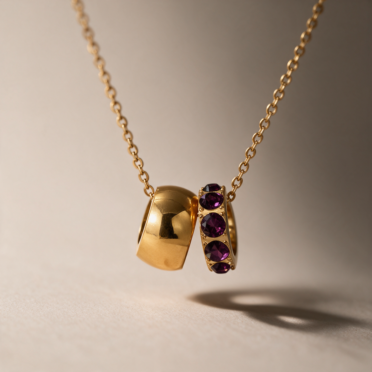The Linked Birthstone Necklace in purple.