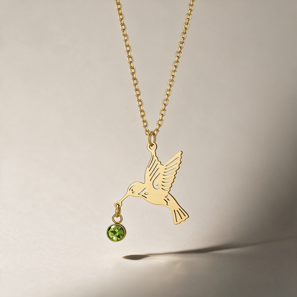 The Hummingbird Birthstone Necklace with the August birthstone.