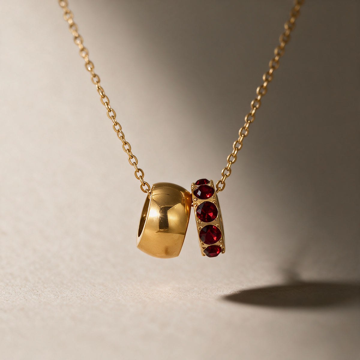 The Linked Birthstone Necklace in red.
